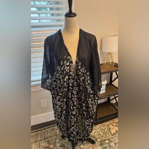 Randi & Will elegant shawl black and gold with slight fringe at bottom.